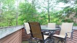 Small back porch for outdoor dinning at Forest Rim Condo in the Heart of Waterville Valley, NH